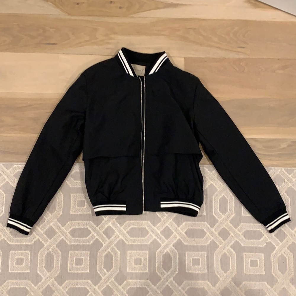 Black bomber jacket with white stipes